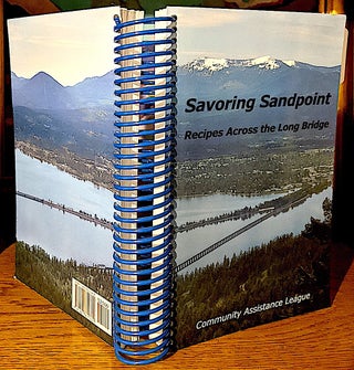 Item #10465 Savoring Sandpoint. Recipes Across the Long Bridge. Diana M. Carlson