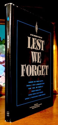Item #10479 Lest We Forget. In the shadow of our past : lest we forget : where on this earth...