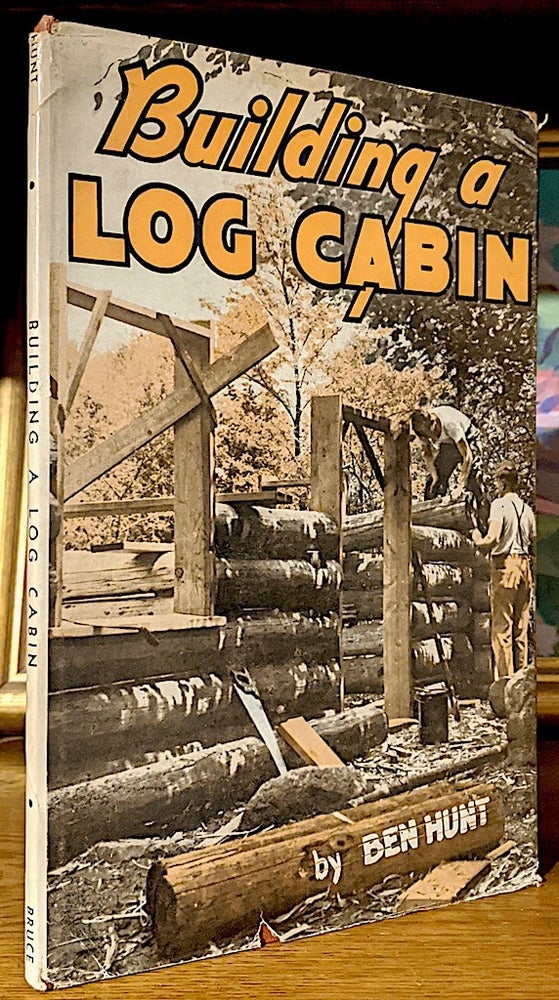 Item #9936 Building a Log Cabin. Ben Hunt.